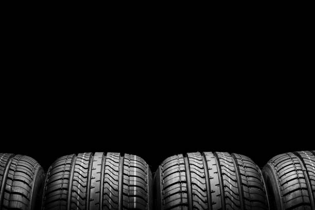 istock a  black isolation rubber tire, on the black backgrounds 1218990783