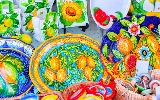 Colourful traditional ceramics vases and head souvenirs at street market stores and shops in luxury Ravello town near Positano and Amalfi Coast in Italy in summer. Vacation and holiday on Amalfitana