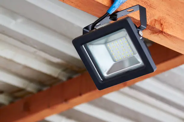 Photo of LED flood light, spot light on the top of the roof