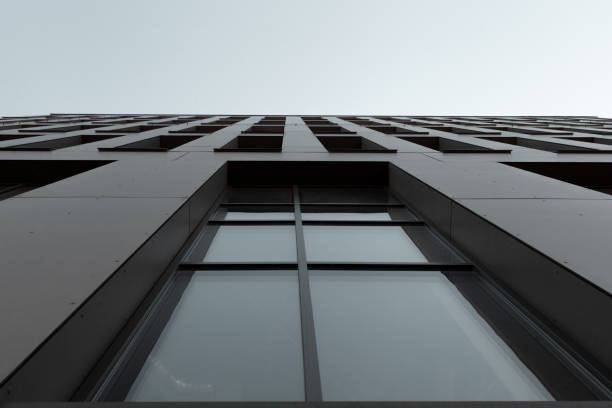 istock Windows and other facade elements of a large building. Perspective of a office skyscraper 1218991999
