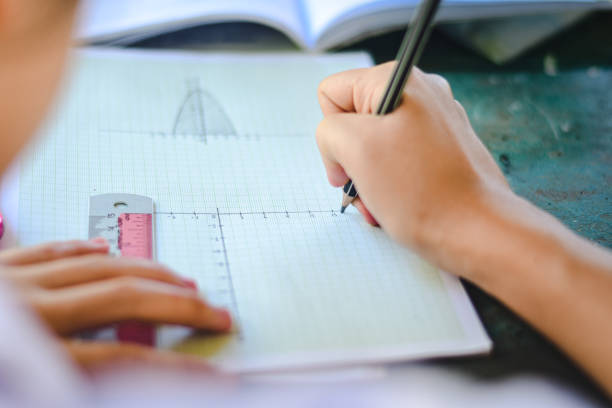 istock Close up to students writing.Hand of students 1218992860