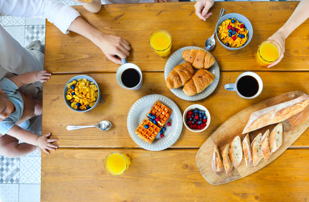 istock Family of three having breakfast In the kitchen 1218993708