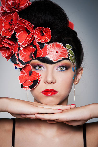 istock Beautiful girl with red flowers 121899756