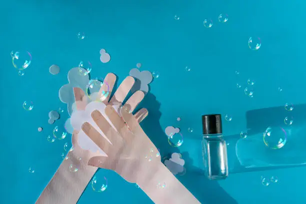 Washing hand with soapa and soapbubbles. Good personal hygiene habits. Healthcare concept. Space for text. Top view.