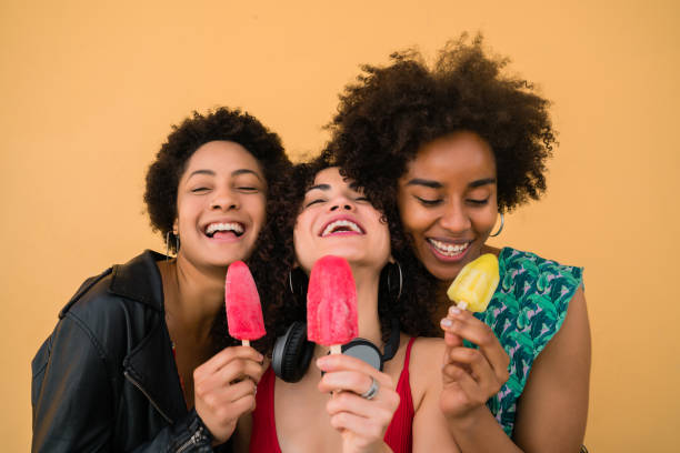 istock Multi-ethnic group of friends enjoying summertime while eating ice cream. 1218999262
