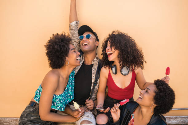 istock Multi-ethnic group of friends enjoying summertime while eating ice cream. 1218999292