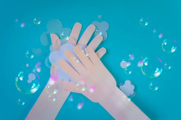 Washing hand with soap and soapbubbles. Good personal hygiene habits. Healthcare concept. Space for text. Top view.