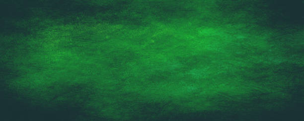 istock Green background with dark shadow   border and old vintage grunge texture 1218999661