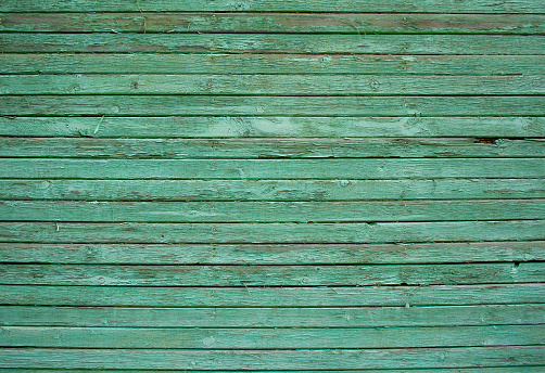 Texture of green wooden planks, old barn wall, rustic style