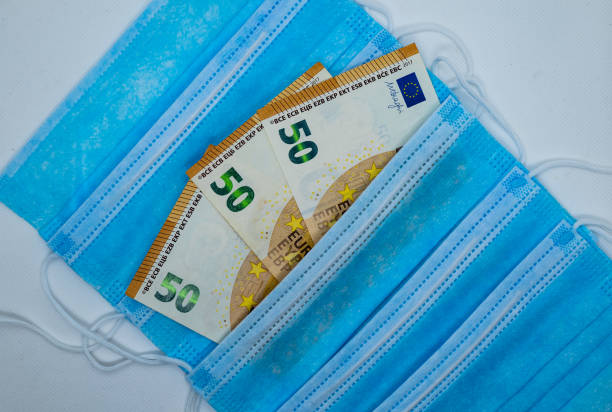istock 50 Euro bank note with protective surgical face masks 1219001234