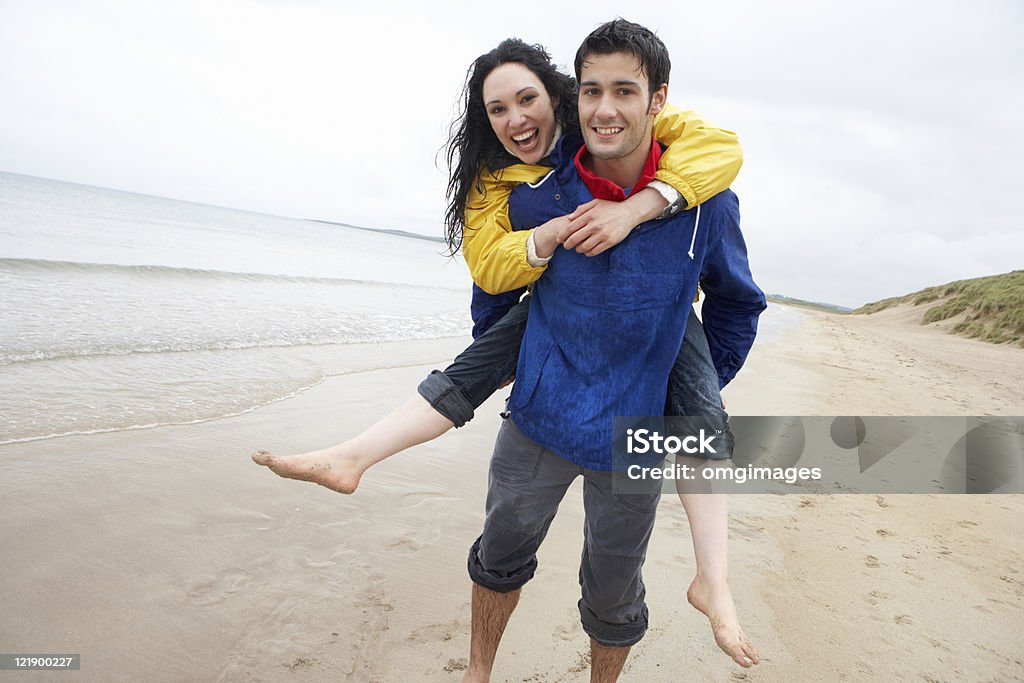 Happy couple on beach in love  20-29 Years Stock Photo