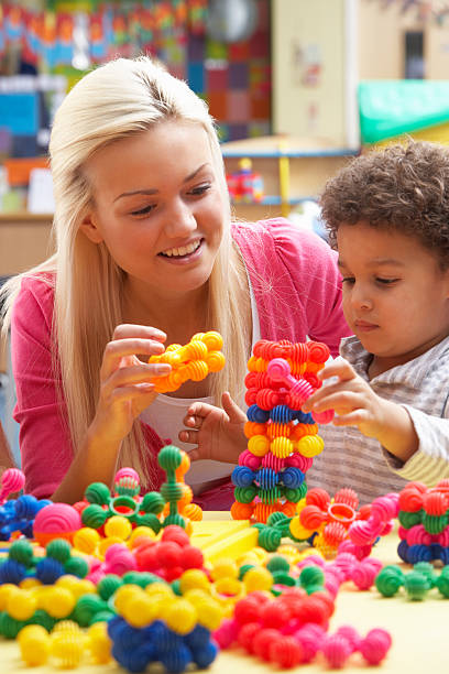 istock Young woman playing with boy 121900329