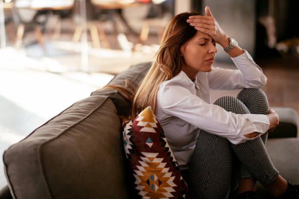 istock Woman with a stomach ache 1219003680