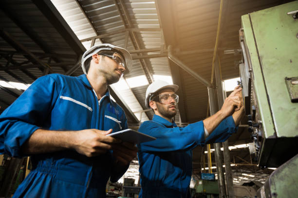 istock Industrial workers are working on projects in large industrial plants with many devices. 1219003966