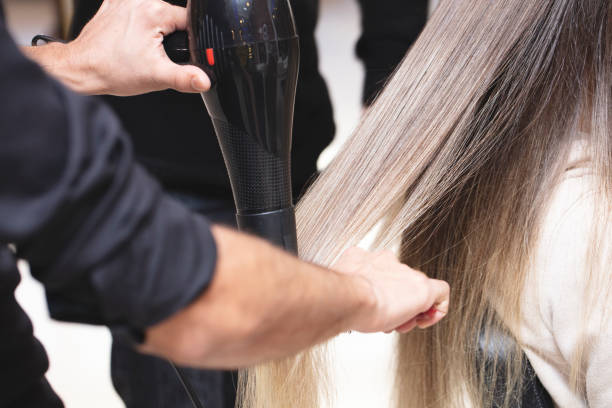 istock Stylist Drying Girl's Hair 1219005109