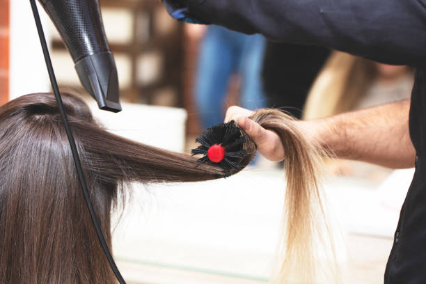 istock Stylist Drying Girl's Hair 1219005122
