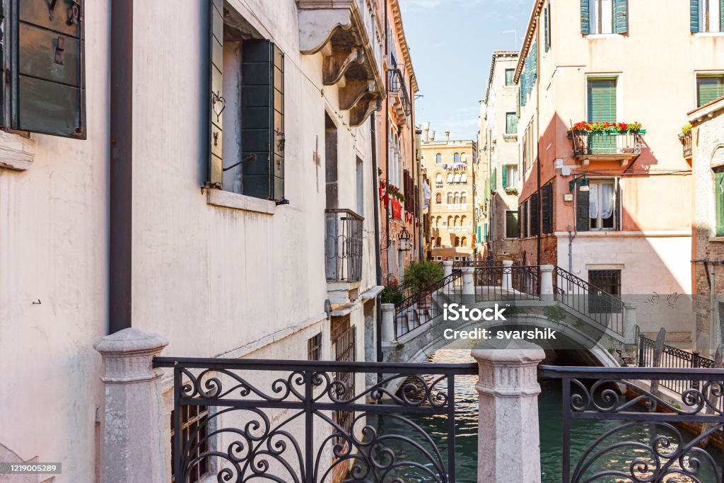 Bridges  over a narrow canal in the old town of Venice, Italy Bridges over a narrow canal in the old town of Venice, Italy Architecture Stock Photo