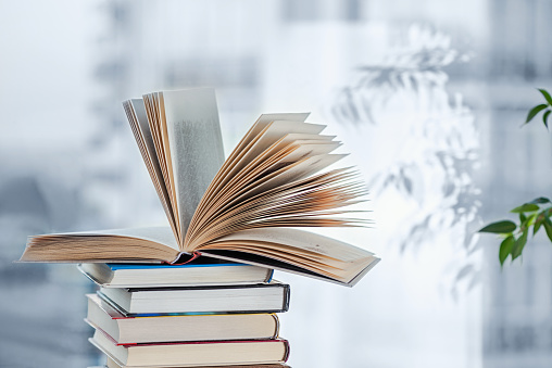 Books on a window background. Education concept.