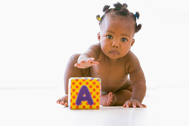 Baby playing with block  cute black babys stock pictures, royalty-free photos & images