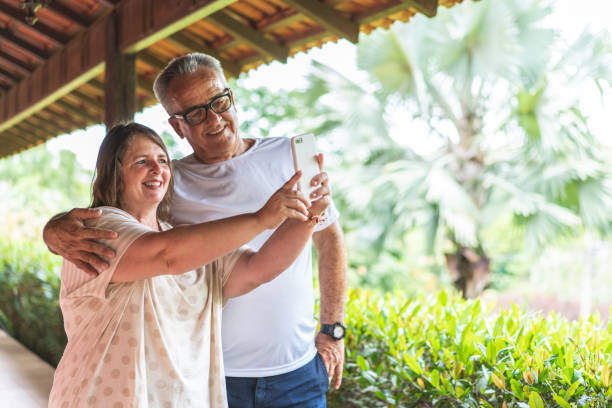 istock Mature couple taking a selfie on the terrace 1219009069