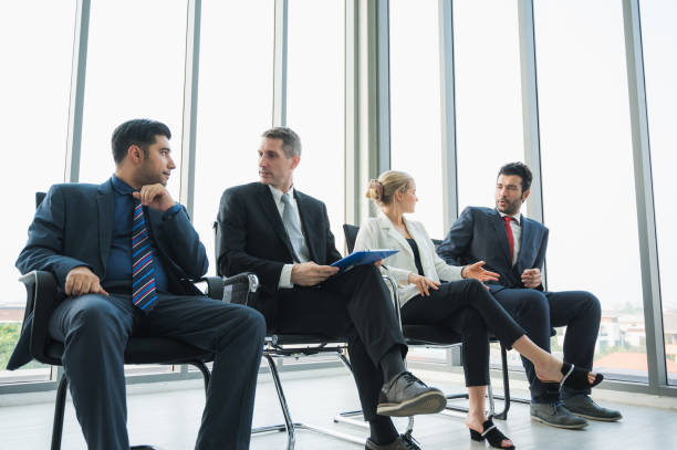 istock Business People Meeting Conference Discussion Corporate Concept in office. Team analyzing statistics financial. 1219009586