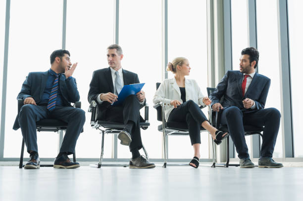 istock Business People Meeting Conference Discussion Corporate Concept in office. Team analyzing statistics financial. 1219009801