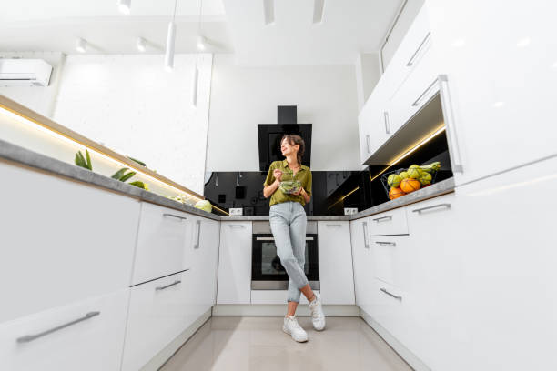istock Woman with healthy food on the modern kitchen 1219009832