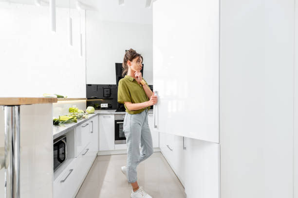 Woman cooking on the white kitchen