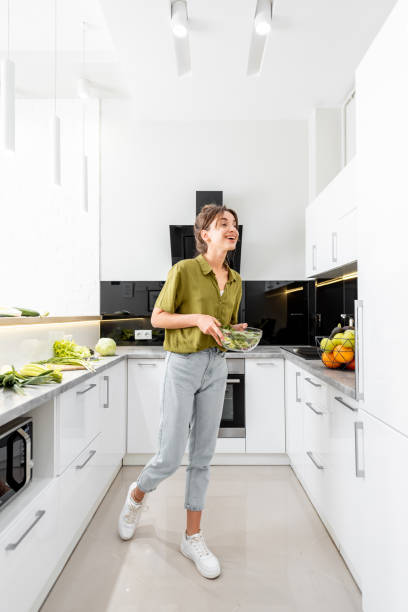istock Woman cooking on the white kitchen 1219009860