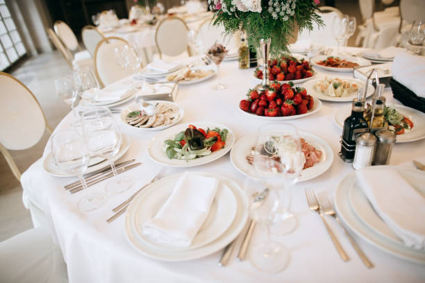 Restaurant table with food. Catering service. Wedding celebration, decoration. Dinner time, lunch. Restaurant table with food. Catering service. Wedding celebration, decoration. Dinner time, lunch. wedding hall stock pictures, royalty-free photos & images