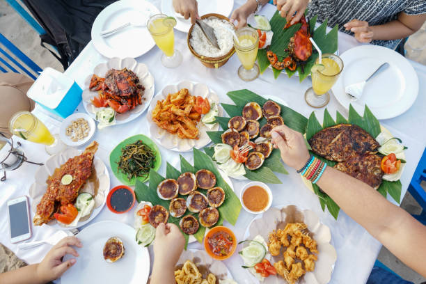 istock Eating seafood together on the beach. 1219012209