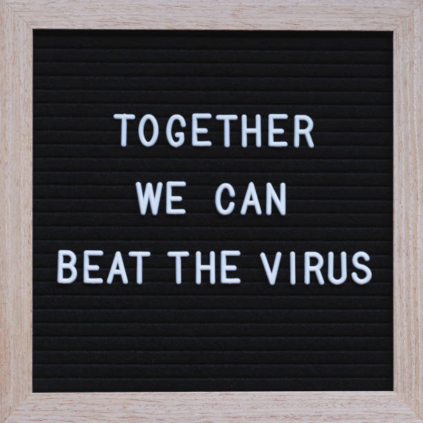 istock Together we can beat the virus text on blackboard 1219013709