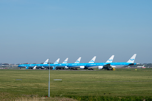 Part of the fleet of aircrafts of KLM, the Royal Netherlands Airline, is parked on runway 36R-18L at Schiphol Amsterdam Airport due to the COVID-19 crisis.