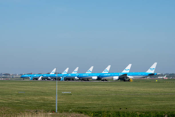 Part of the KLM fleet parked due to Corona crisis Part of the fleet of aircrafts of KLM, the Royal Netherlands Airline, is parked on runway 36R-18L at Schiphol Amsterdam Airport due to the COVID-19 crisis. klm stock pictures, royalty-free photos & images