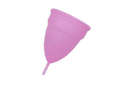 Copa menstrual de silicona reutilizable rosa aislada sobre fondo blanco photo