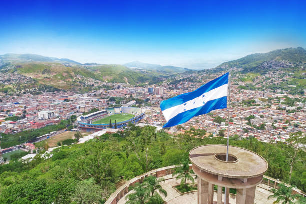 Honduras flag in Tegucigalpa A droone photo from Cerro Juana Lainez with Honduras flag and the city of Tegucigalpa honduras stock pictures, royalty-free photos & images
