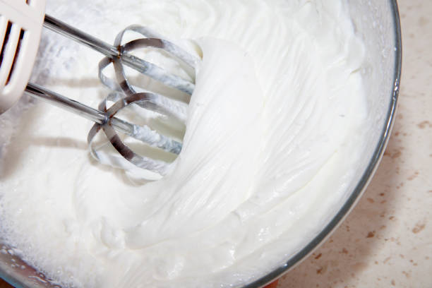 istock making whipped cream with a mixer in the kitchen 1219022480