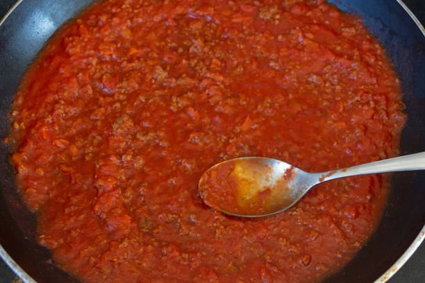 istock Bolognese sauce cooking in a frying pan 1219024319