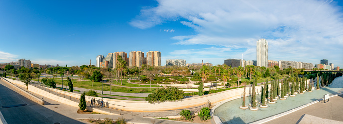 Panoramic view of the Turia Garden, Section XIII.\nThe Turia Garden is one of the largest urban parks in Spain. It runs through the city along nine kilometers of green spaces with pedestrian paths, leisure and sports areas. Crossed by 18 bridges full of history, the old river channel passes through the main museums and monuments of the city on any of the banks.