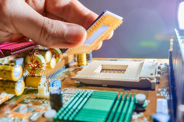 istock The technician is putting the CPU on the socket of the computer motherboard. Close up 1219026890