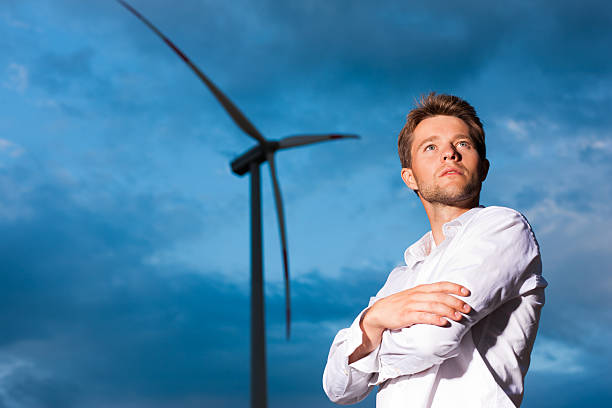 istock Man in front of windmill and sky 121902837