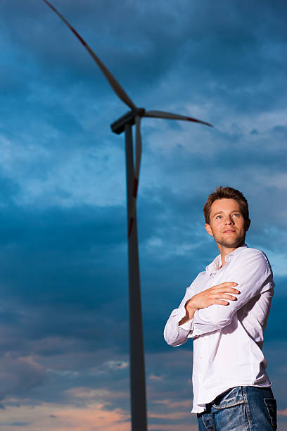 istock Man in front of windmill and sky 121902840