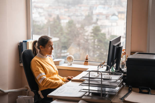 istock Stay at home. Young professional working at home. COVID-19 quarantine. 1219028795
