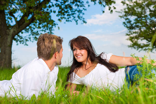 istock Happy couple lying on a meadow 121903076