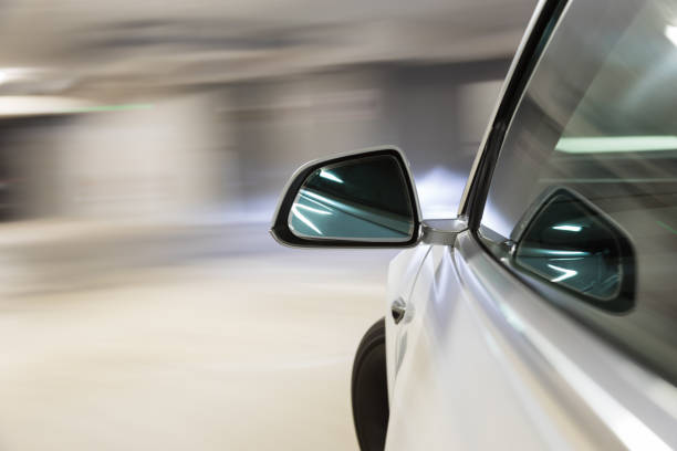 istock Car light trail while driving in the coty by night 1219030977