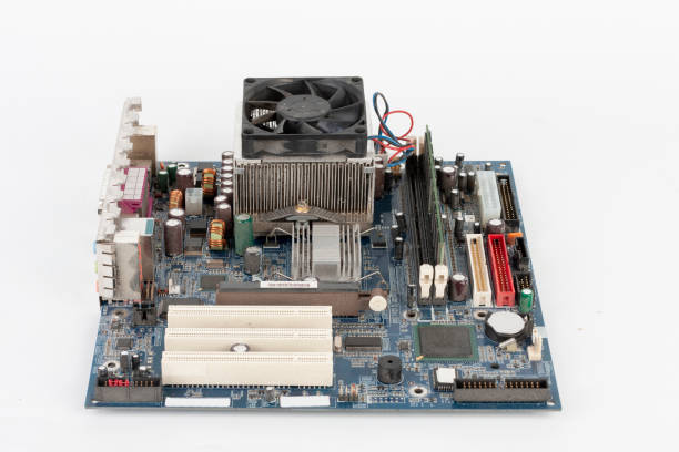 istock Main board of desktop computer, CPU cooler fan, memory module in slot on motherboard. 1219031176