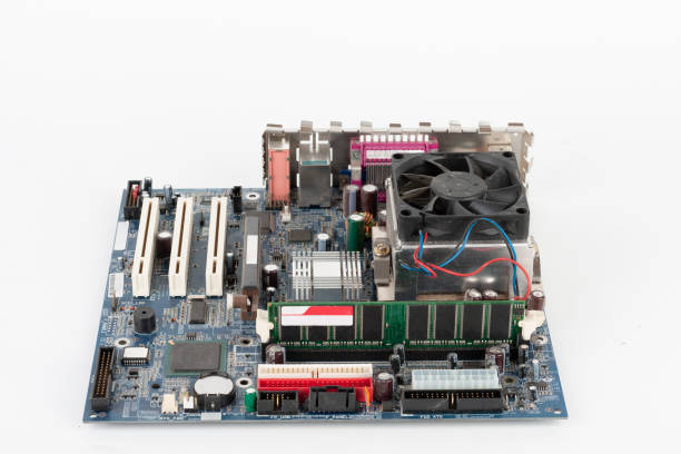 istock Main board of old desktop computer, CPU cooler fan, memory module in slot on motherboard. 1219031251