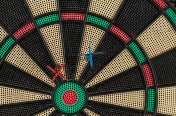 istock Red and blue dart arrrow hitting in the target.Darts sport concept. 1219032194