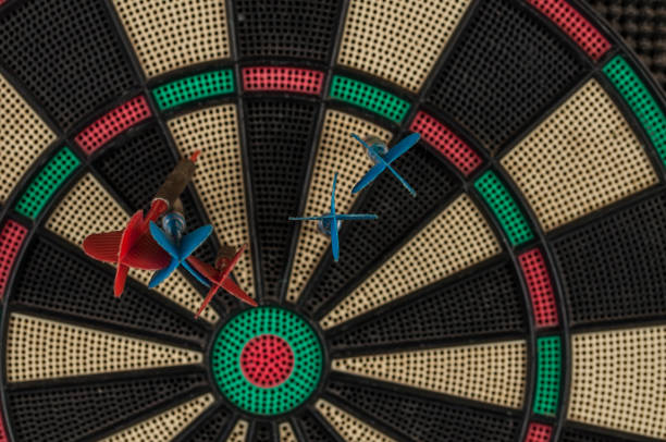 istock Red and blue dart arrrow hitting in the target.Darts sport concept. 1219032293
