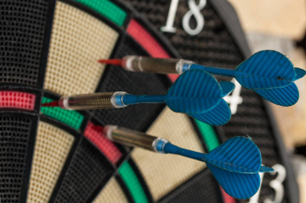 istock Red and blue dart arrrow hitting in the target.Darts sport concept. 1219032343